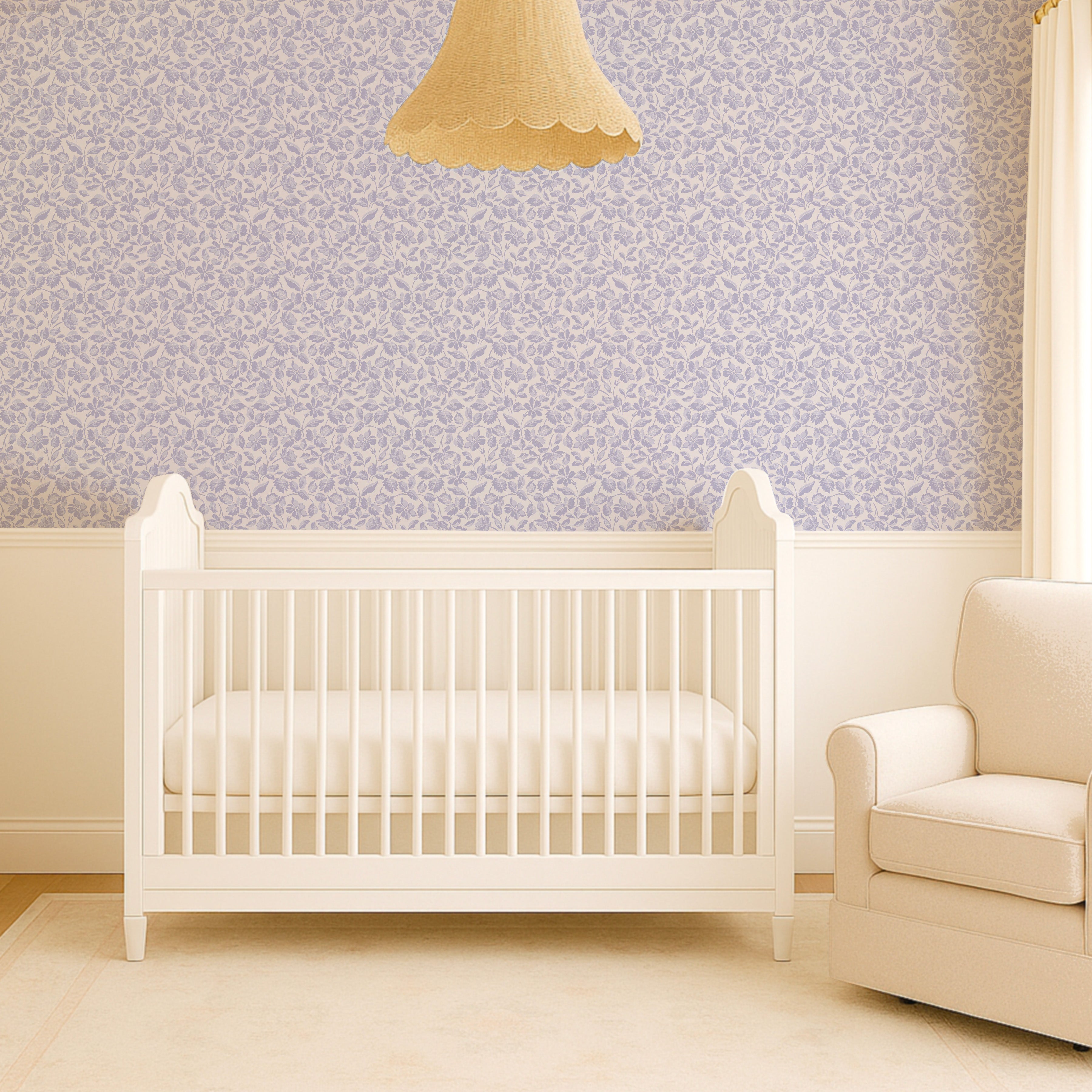 Nursery room with a white crib and beige chair against a patterned wall.